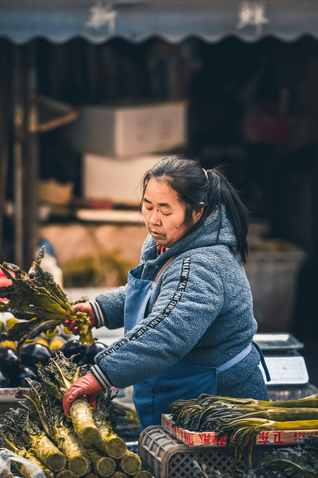 Portrait of a young Danish woman selling flowers at an outdoor market