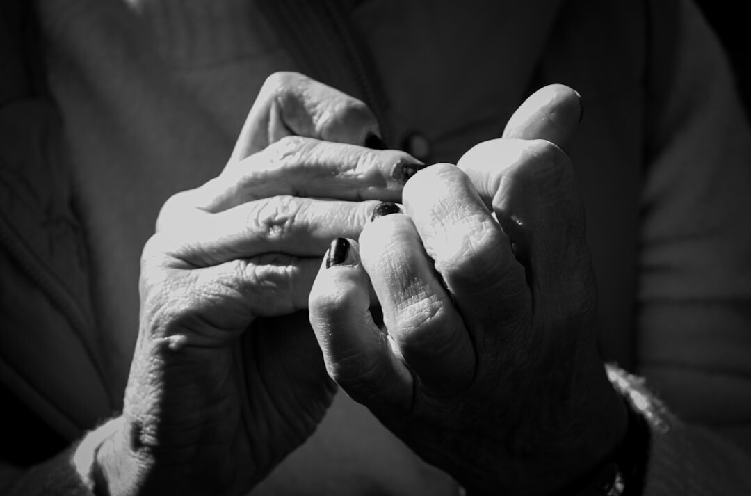 elderly hands holding photo