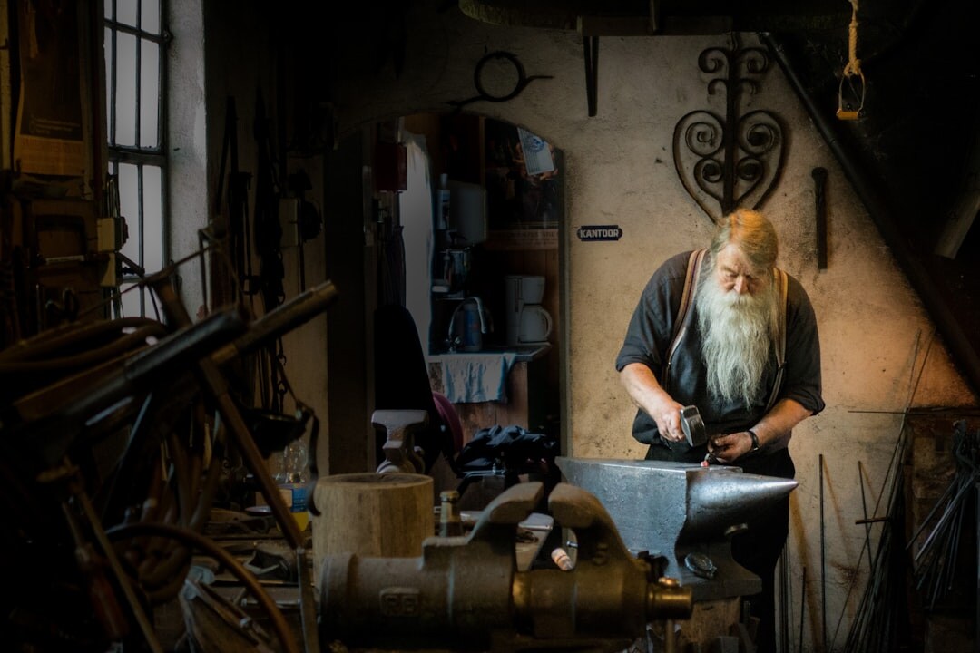 Portrait of a Danish woodworking craftsman in his workshop surrounded by tools